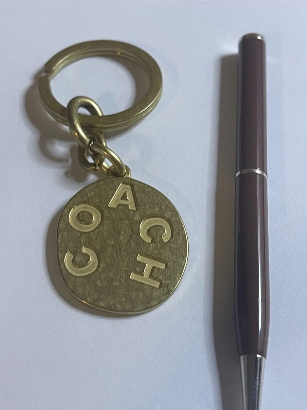 Coach Brass-Tone Round Logo Keychain and Coach Pen